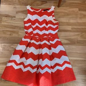 Fit and Flare pleated dress with pockets.